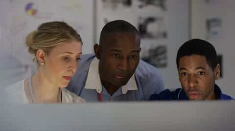 4K Engineering team working together, looking at computer screen 스톡 동영상 63314874