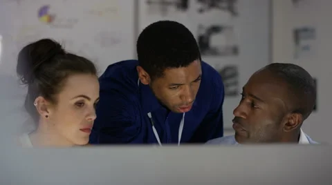 4K Engineering team working together, looking at computer screen 스톡 동영상 63316825