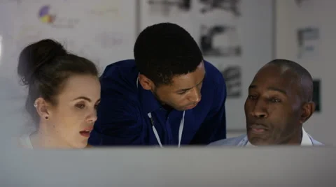 4K Engineering team working together, looking at computer screen 스톡 동영상 63317524