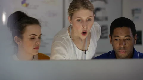 4K Engineering team working together, looking at computer screen 스톡 동영상 63318266