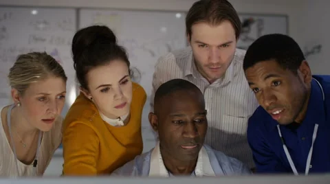 4K Engineering team working together, looking at computer screen 스톡 동영상 63319369