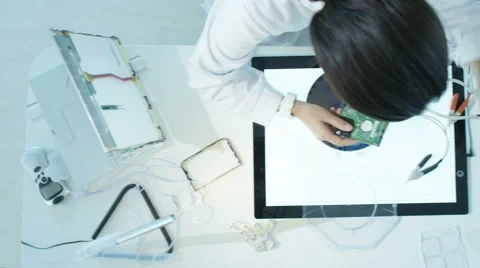 4K Engineers in electronics factory building &amp; testing electronic devices Stock Footage 67708278