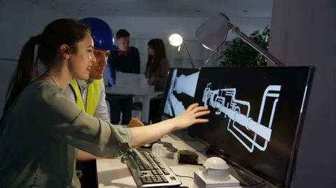 4K Engineers working on a project using computer software &amp; discussing ideas Stock Footage 61166355