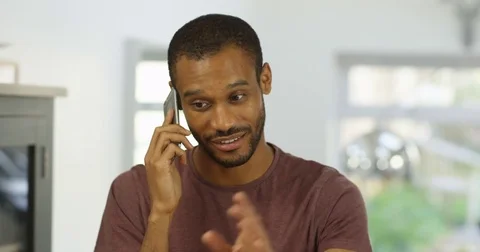 4K Enthusiastic businessman discussing creative ideas with colleague over phone Stock Footage 82287316