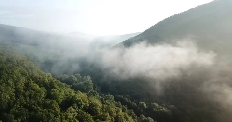 4K Epic Aerial Flight Through Mountain Clouds on Sunrise Beautiful Morning. Stock Footage 92725682