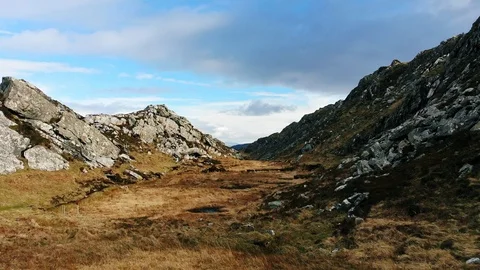 4k epic aerial low through rocky valley Ireland Video stock 89229912