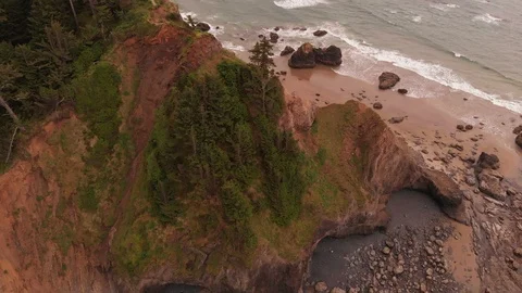 4K Epic Pan and Pullback of Ecola State Park and Great Cannon Beach Aerial Stock Footage 111114513