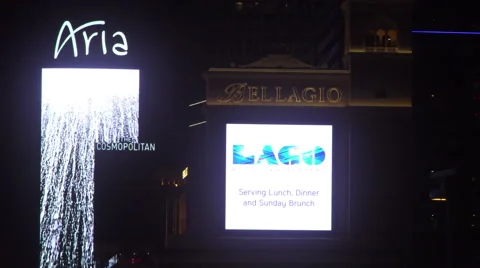 4K ES: Main Digital Marquee of the Bellagio &amp; Aria Hotels on The Las Vegas Strip Stock Footage 63083243
