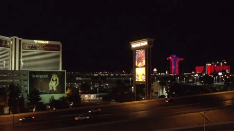 4K ES: Traffic Flows Along I-15 Through the Heart of Las Vegas Stock Footage 64567326