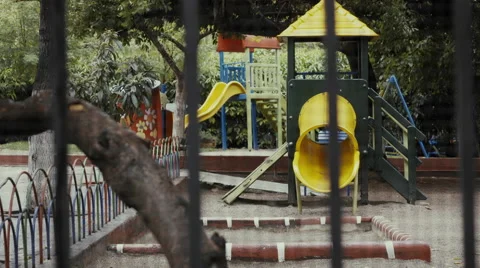 4k establishing shot empty urban public playground behind fence/wire Stock Footage 55733749
