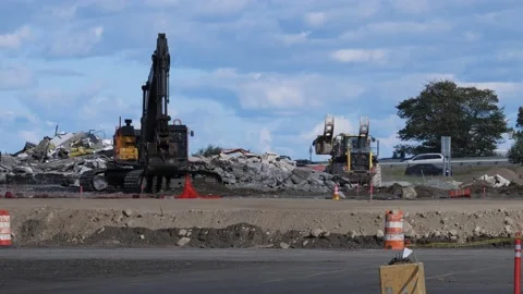 4K Excavator and Front Loader machinery remove building demolition materials Stock Footage 237722799