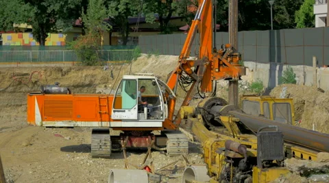 4K, Excavator digging a hole Stock Footage 53226108