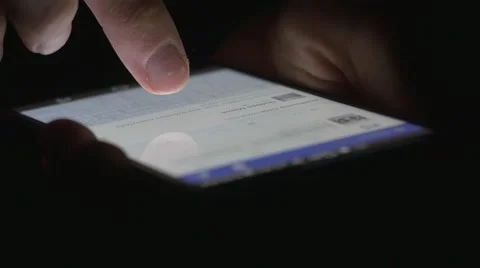 4K Facebook Browsing on Smartphone in Darkness Stock Footage 59057238