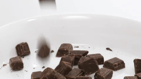 4K - Falling pieces of chocolate Stock Footage 248468765