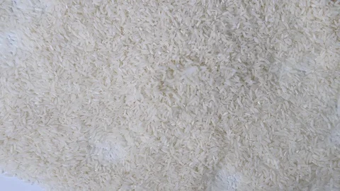 4K falling pile of dry white long grain rice from above for cooking with Stock Footage 88482517