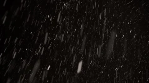 4K Falling Snow Variable Winds Black Background real snowfall footage with Stock Footage 330092787