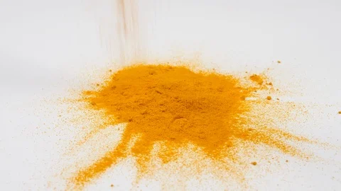 4K falling Yellow Turmeric on white surface background herbs and spices Stock Footage 88479207