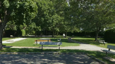 4k - Far old man walking in a small park Video stock 67407493