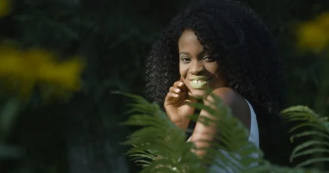 4k. Fast and slow motion. Attractive African American woman with green eyes and Stock Footage 99786902