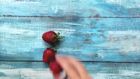 4K Fast folding strawberries on the table Stock Footage 107866607