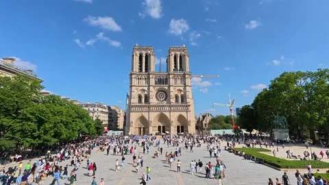 4k fast motion view of Notre-Dame Cathedral and cityscape in Paris, spring day Stock Footage 314400510