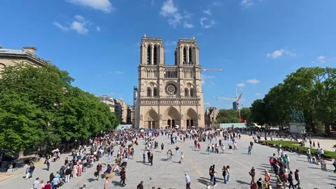 4k fast motion view of Notre-Dame Cathedral and cityscape in Paris, spring day Stock Footage 314400528