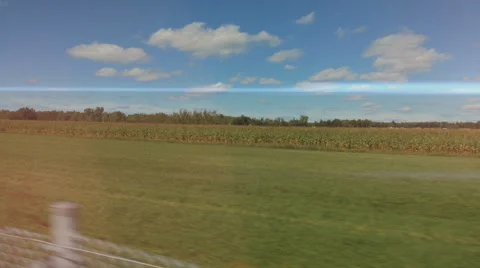 4k - Fast moving camera near a farm field with light leaks Stock Footage 67407332