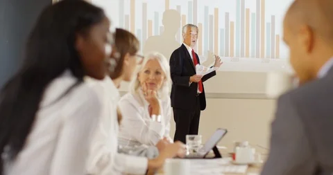 4K Fed up businessman trying to give presentation with bored colleagues ignoring Stock Footage 101295518