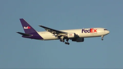 4K FedEx mail cargo plane Boeing 767, final approach runway landing Stock Footage 92097528