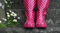 4K feet wiggling in red and white wellies (boots) on a gray staircase, summer 4k or 4k+ Resolution
