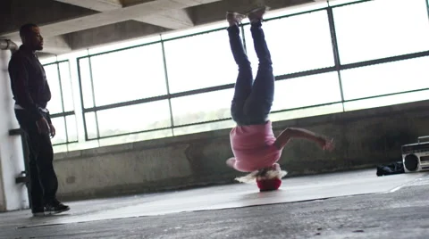 4K Female breakdancer ends her dance, in slow motion, shot on Red Epic Dragon Stock Footage 54760796