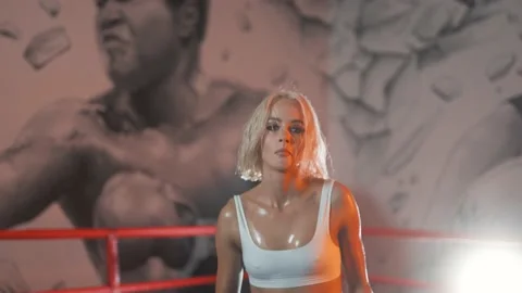 4K - Female dancer jumping while dancing, sexy girl wearing boxer outfit in ring Video stock 212010481