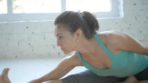 4K, Female Doing Stretching Workout On Exercise Mat At White Fitness Class Stock Footage 95498474