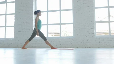 4K, Female Doing Stretching Workout On Exercise Mat At White Fitness Class Stock Footage 95499189