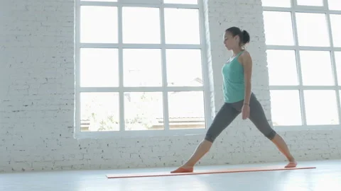 4K, Female Doing Stretching Workout On Exercise Mat At White Fitness Class Stock Footage 95998971