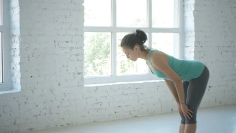 4K, Female Doing Stretching Workout On Exercise Mat At White Fitness Class Stock Footage 96000547