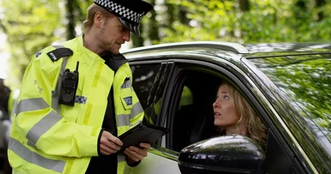 4K Female driver making excuses to policeman to try and avoid getting a ticket Stock Footage 113135584