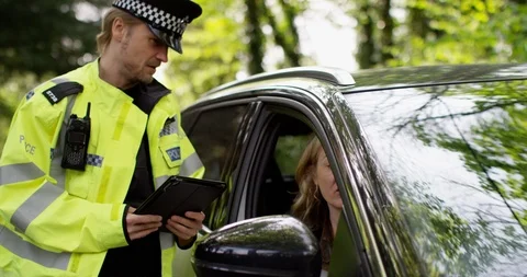 4K Female driver making excuses to policeman to try and avoid getting a ticket Stock Footage 113136165