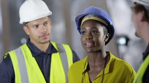 4k female engineer or architect discussing construction with male colleagues Stock Footage 54091596