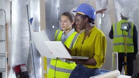 4k Female engineers or architects working together at construction site Stock Footage