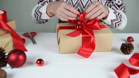4k Female hands making gift box for Christmas and New Year Stock Footage 144931459