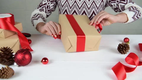 4k Female hands making gift box for Christmas and New Year Stock Footage 144933599