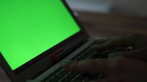 4K female hands type on computer in darkness- greenscreen on desktop Stock Footage 55486865