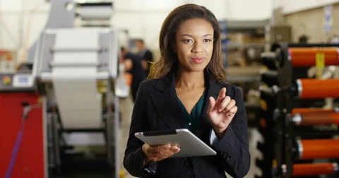 4k, A female warehouse manager with a digital tablet checking inventory. Stock Footage 68957779