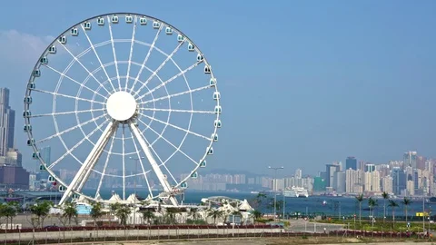 4K Ferris wheel amusement in central Hong Kong. Downtown skyline background-Dan Stock Footage 74489960