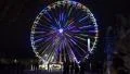 4k Ferris Wheel with great illumination at Christmas fair and people 4k or 4k+ Resolution