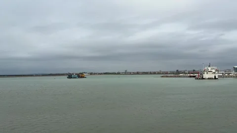 4K Ferry Approaching Busy Passenger Terminal in Haikou Port Stock Footage 331969556