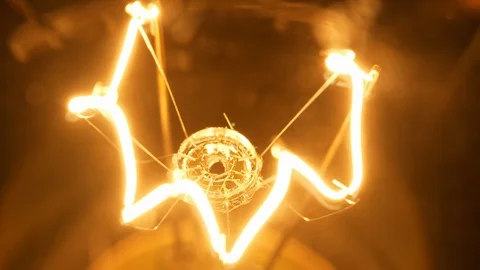 4K - Filament of a light bulb. Close-up Video stock 125444568