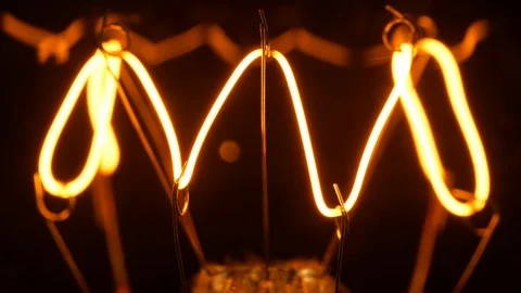 4K - Filament of a light bulb. Macro Stock Footage 125444614