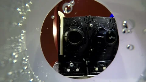 4k filming from the inside of plastic cup on young man pouring more bubble clear Stock Footage 137540255